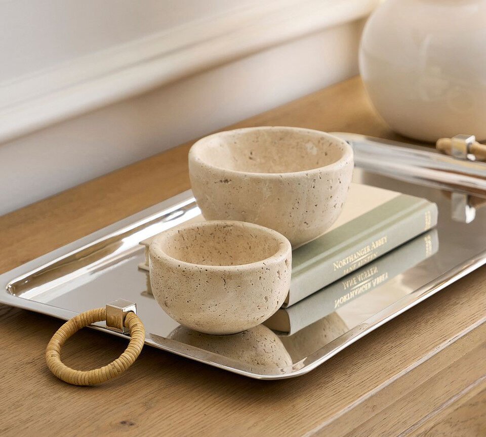Travertine bowls styled with books on a tray